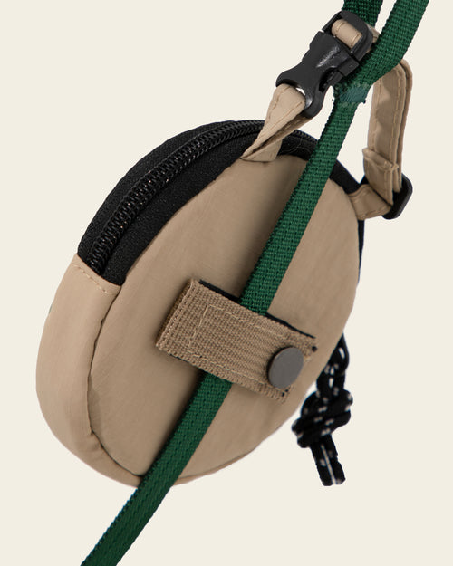 Milk Brown round dog poo bag dispenser and visible components